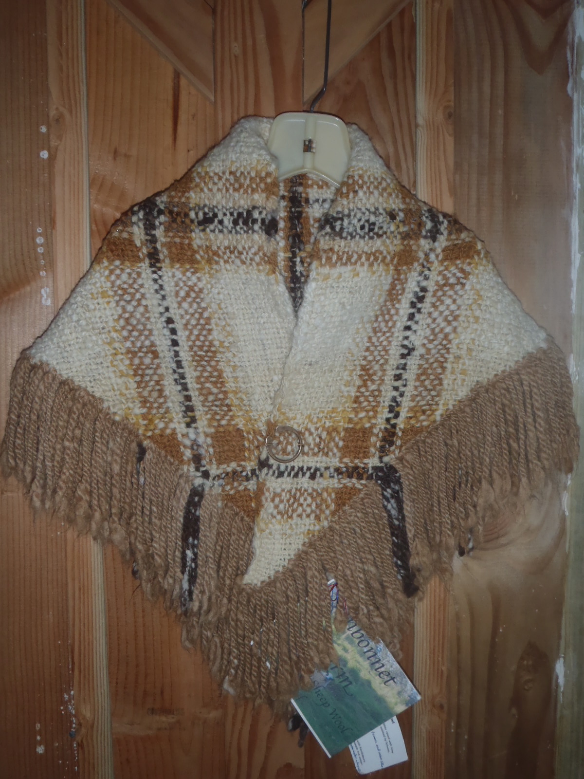 Photo of the shawl with alpaca fringe.